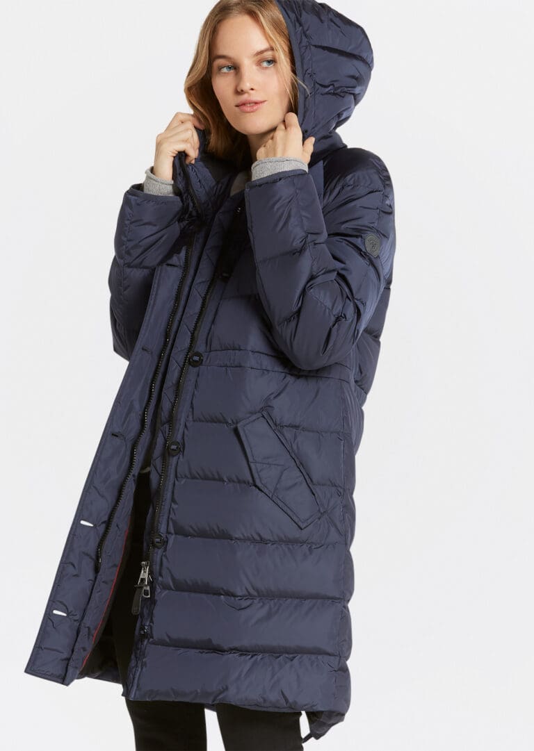 Woman modeling long blue hooded winter coat