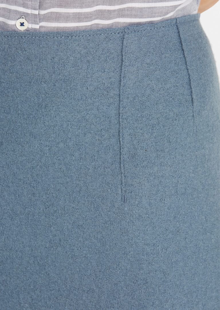 Close-up of blue skirt with seam detail