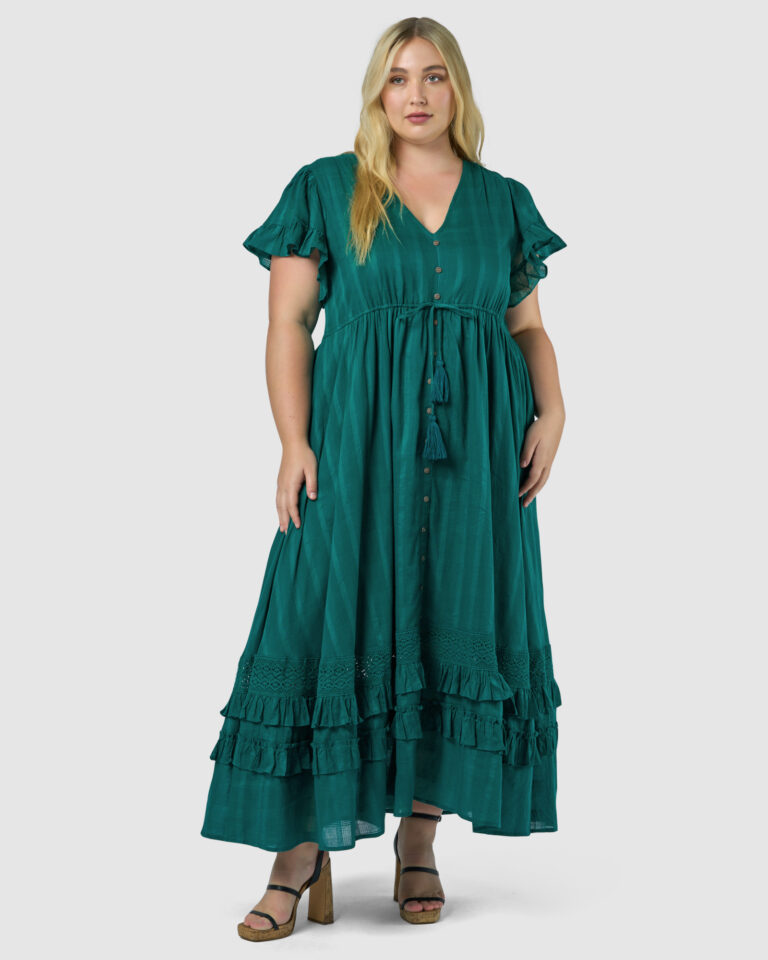 Woman in green ruffled maxi dress