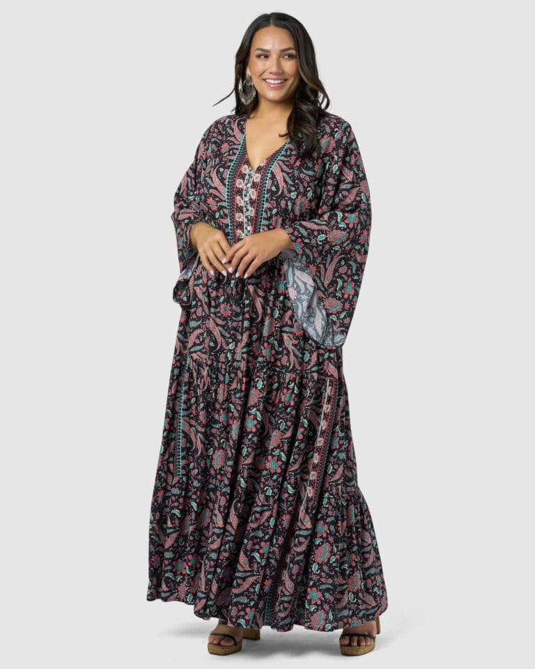 Woman smiling in colorful bohemian maxi dress