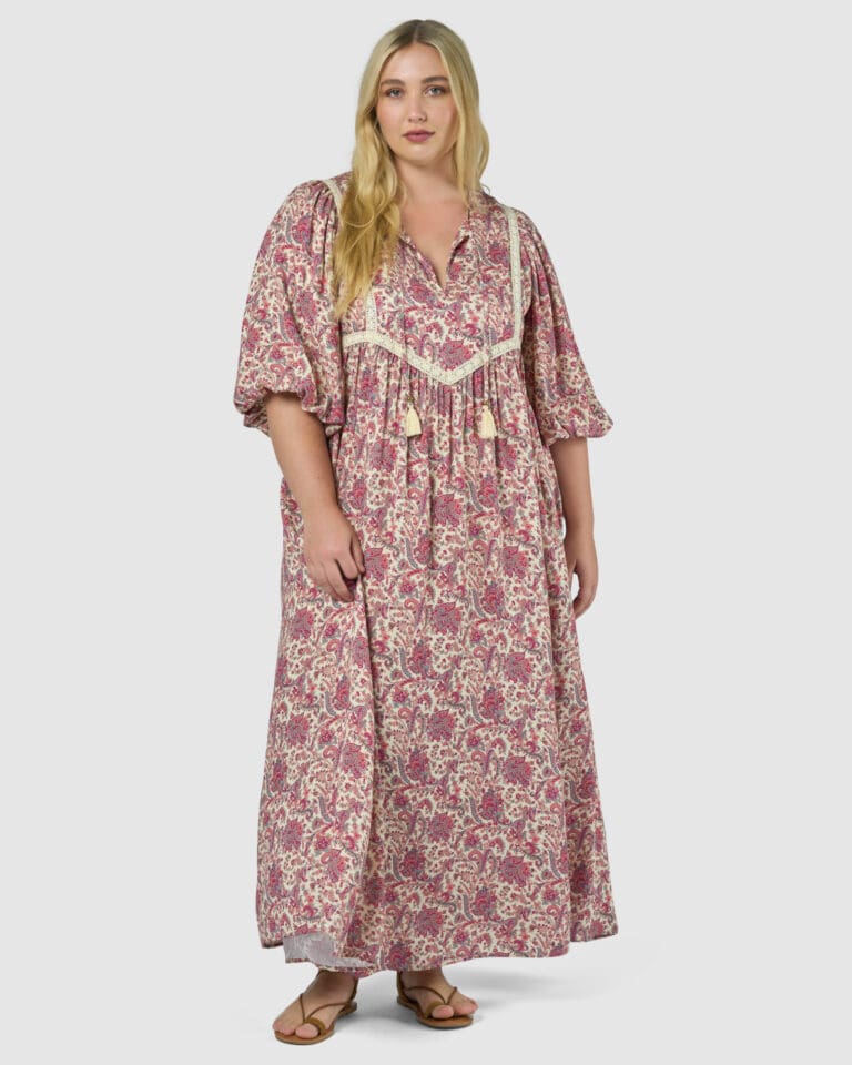 Woman modeling flowing paisley maxi dress