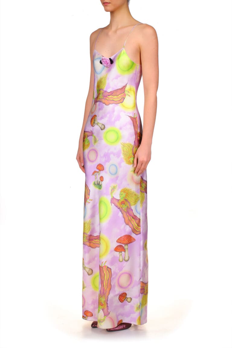 Woman in colorful printed maxi dress standing