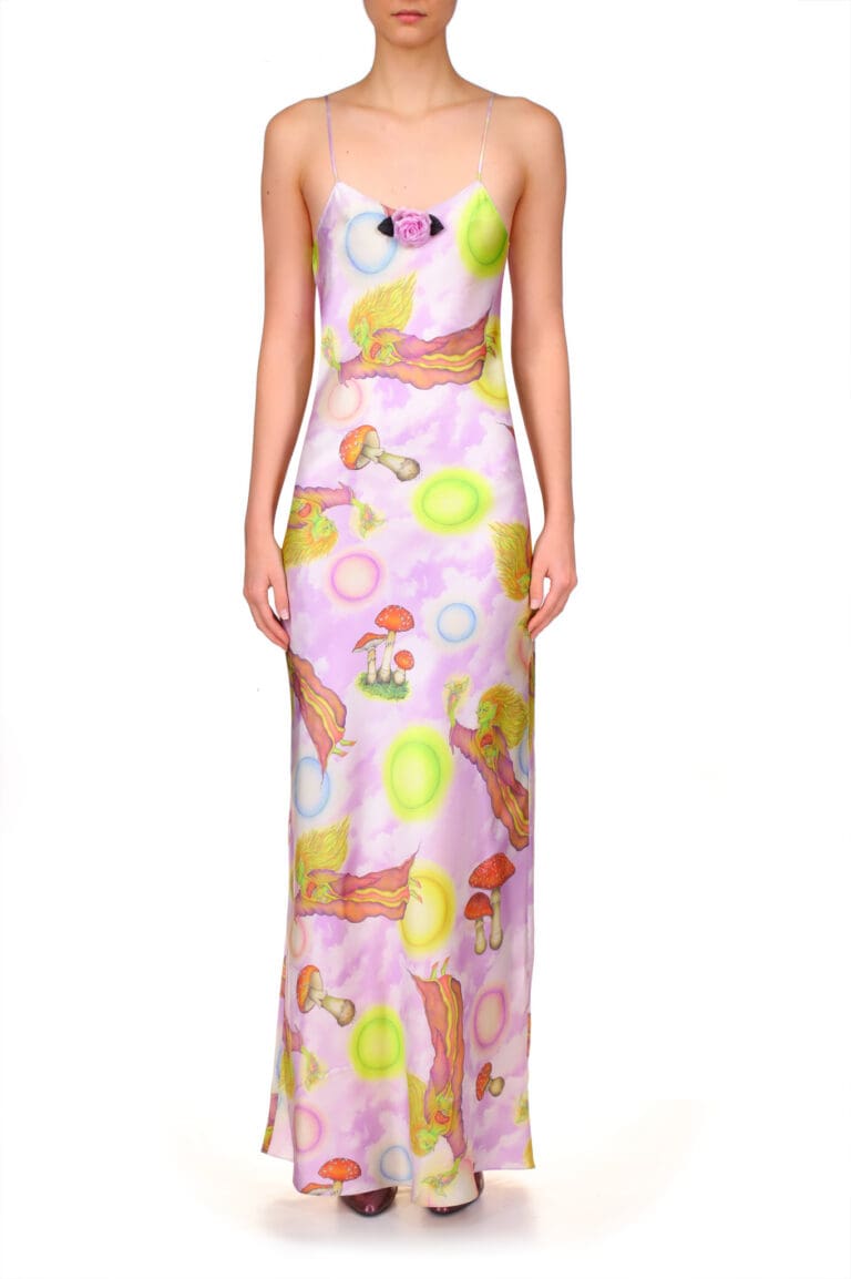 Woman wearing whimsical pastel-printed maxi dress