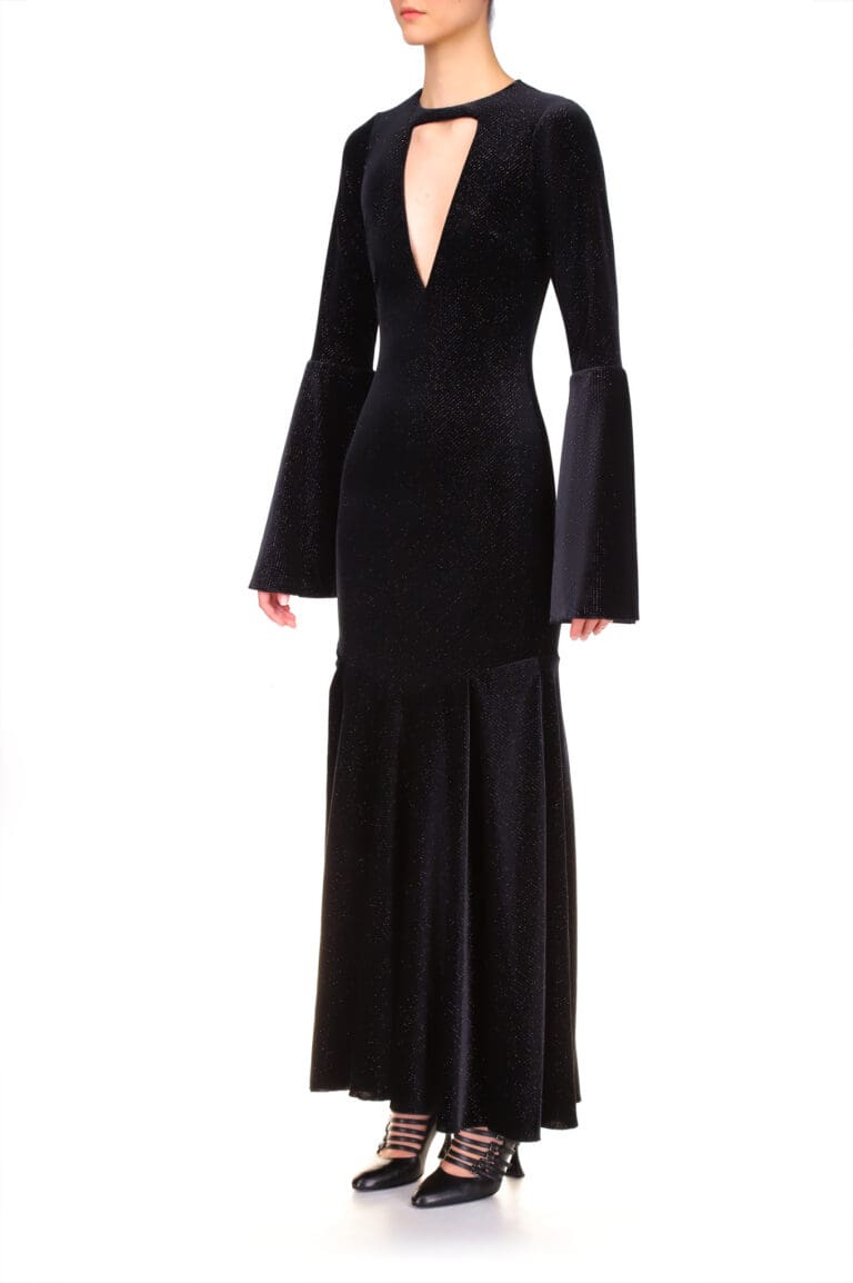 Woman in elegant black glittery long-sleeve dress