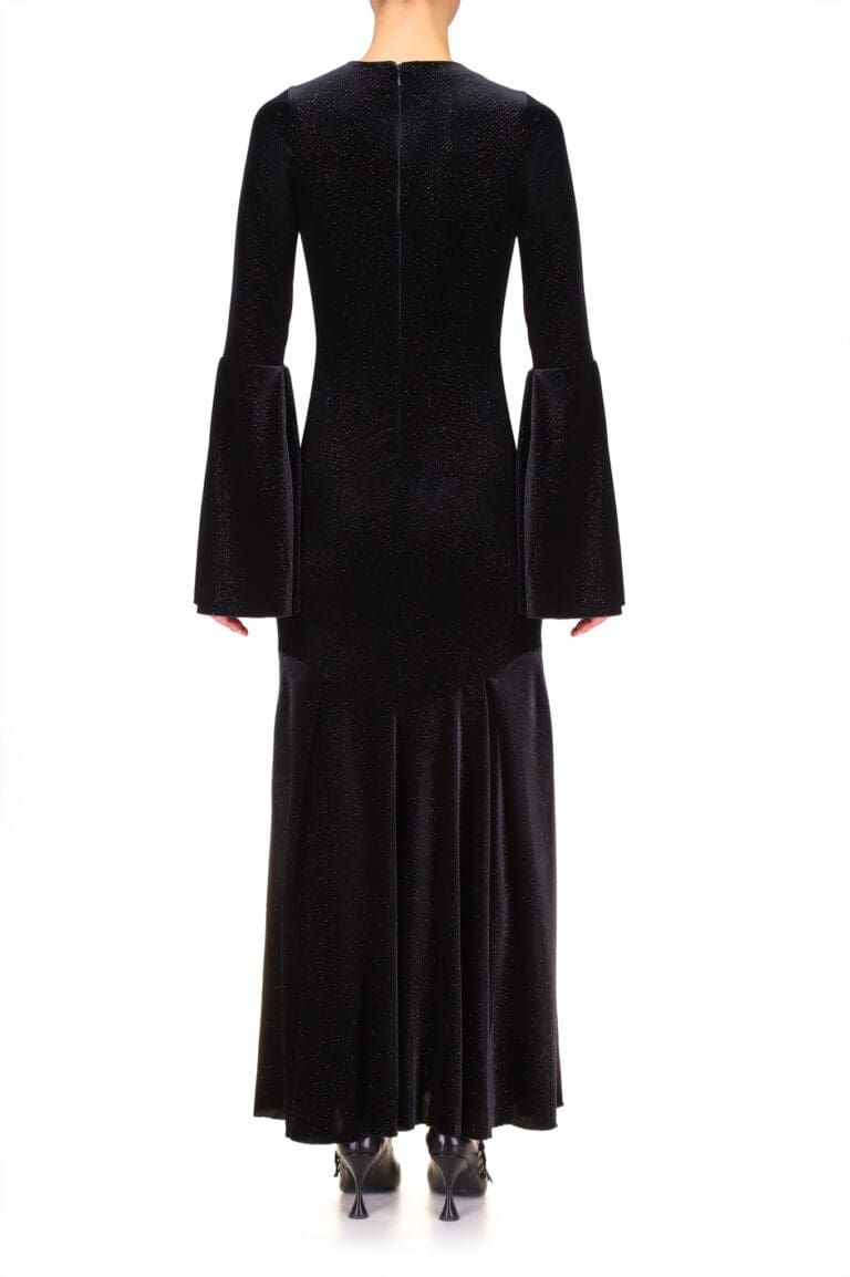 Woman in elegant black glittering bell-sleeve dress