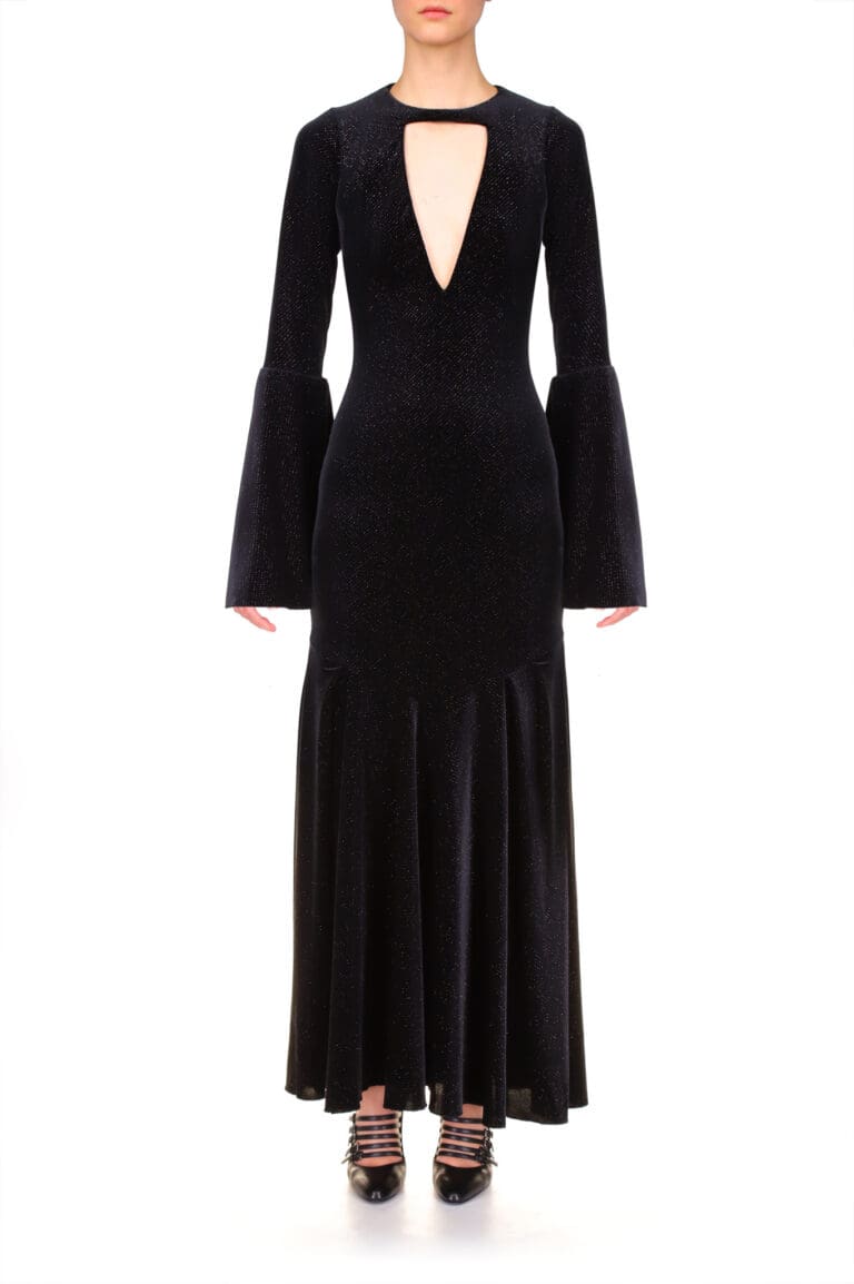 Woman in elegant black glittery dress with bell sleeves