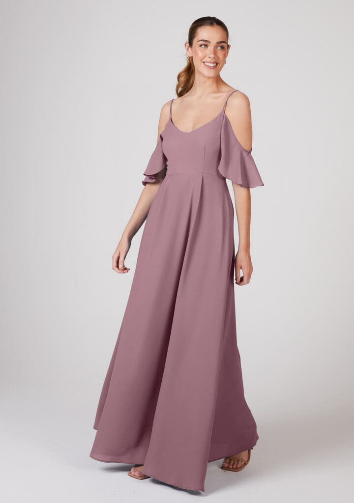 Woman in elegant mauve cold-shoulder gown smiling