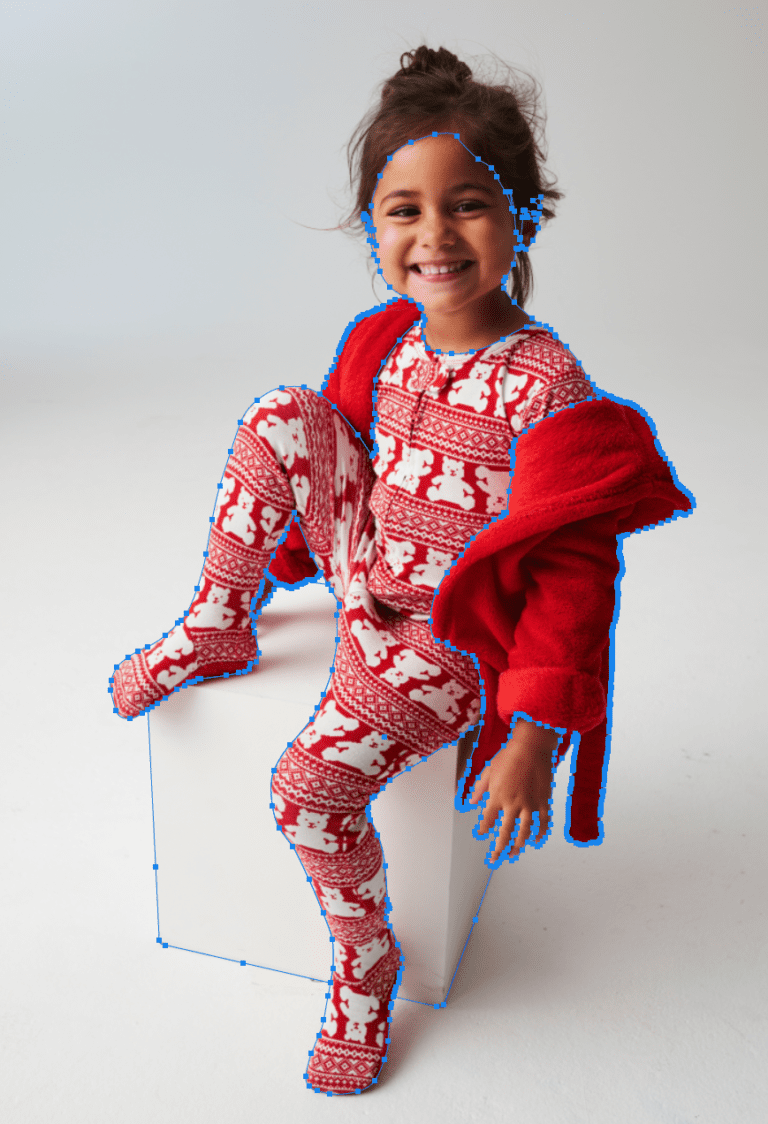 Young girl smiling in festive red winter outfit